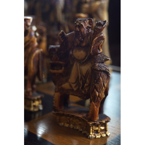 18 - CHESS TABLE AND 30 ANIMALIA AND FIGURAL PIECES