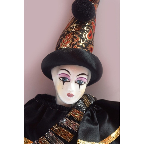 219 - HARLEQUIN PORCELAIN DOLL