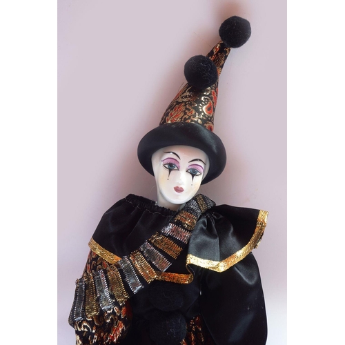 219 - HARLEQUIN PORCELAIN DOLL