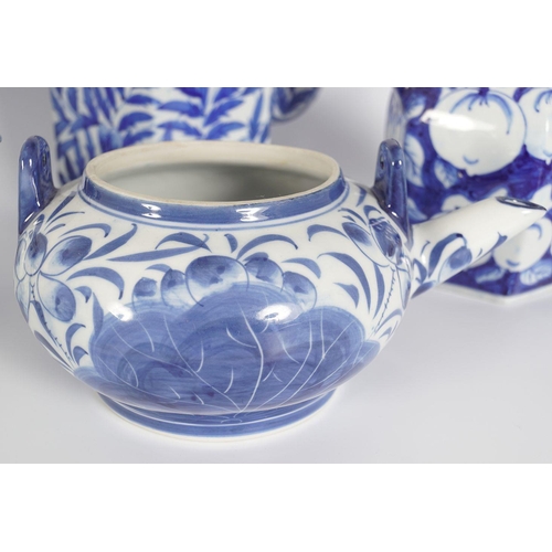 234 - FIVE ORIENTAL BLUE AND WHITE TEA POTS