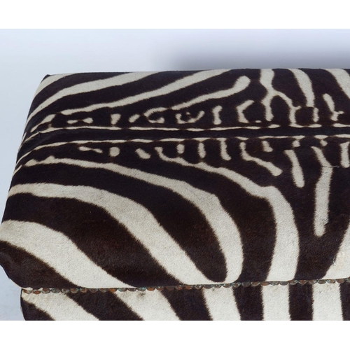 328 - DESIGNER HIDE UPHOLSTERED OTTOMAN