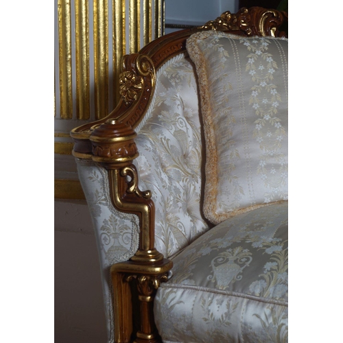 44 - PAIR OF CARVED AND PARCEL GILT SETTEES