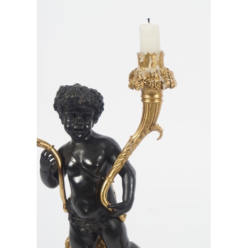 480 - PAIR OF REGENCY GILT BRONZE CHERUB STEMMED CANDELABRA