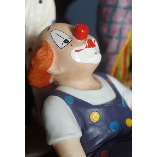 51 - GROUP OF FOUR CLOWN FIGURINES