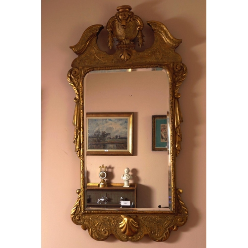 143 - 18TH-CENTURY IRISH CARVED GILT FRAMED MIRROR