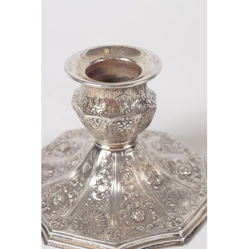 86 - PAIR OF ORNATE SILVER-PLATED CANDLESTICKS