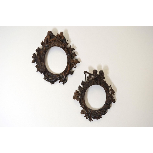 66 - PAIR OF CARVED WOOD FRAMES