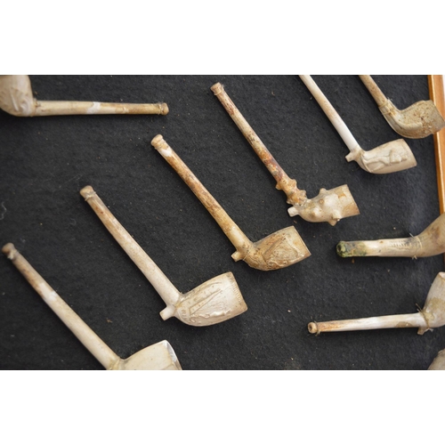 95 - COLLECTION OF 36 MOUNTED CLAY PIPES