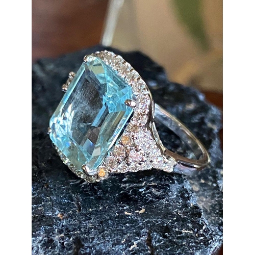 235 - 18 CT. WHITE GOLD AQUAMARINE & DIAMOND RING