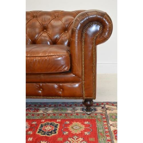 93 - LARGE HIDE UPHOLSTERED ROLL BACK SETTEE