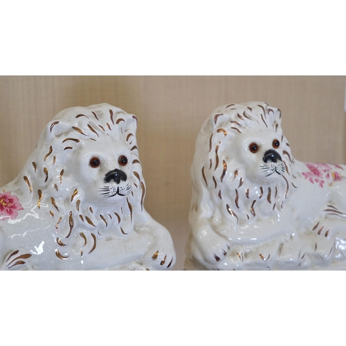 130 - PAIR OF STAFFORDSHIRE SEATED DOGS