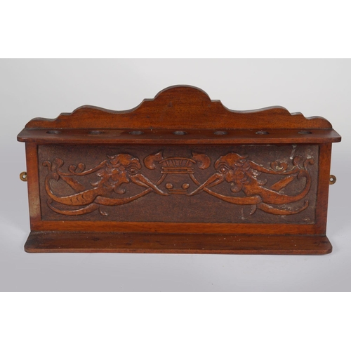 56 - EDWARDIAN CARVED WALNUT PIPE STAND