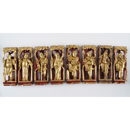 117 - SET OF 8 CHINESE CARVED GILTWOOD LOHAN FIGURES