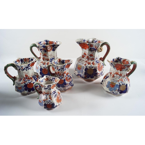 579 - SET OF 6 GRADUATED MASONS JUGS