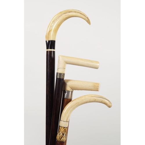 741 - GROUP OF 4 INTERESTING WALKING STICKS