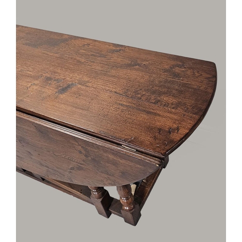 477 - 17TH-CENTURY STYLE OAK GATE LEG DINING TABLE