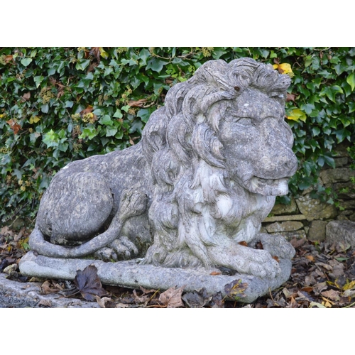 259 - PAIR OF LARGE MOULDED STONE LIONS.