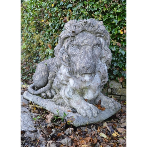 259 - PAIR OF LARGE MOULDED STONE LIONS.