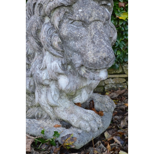 259 - PAIR OF LARGE MOULDED STONE LIONS.