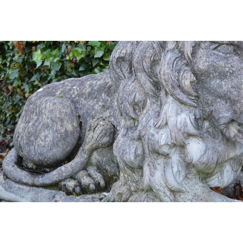 259 - PAIR OF LARGE MOULDED STONE LIONS.