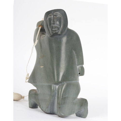 253 - INUIT STONE CARVING OF A FISHERMAN