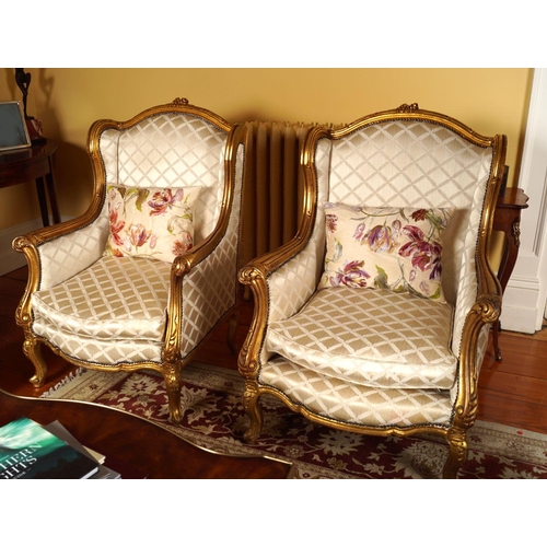 34 - PAIR OF LOUIS XV STYLE CARVED GILTWOOD ARMCHAIRS