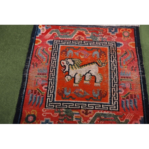 1075 - 19TH-CENTURY CHINESE SADDLE RUGS