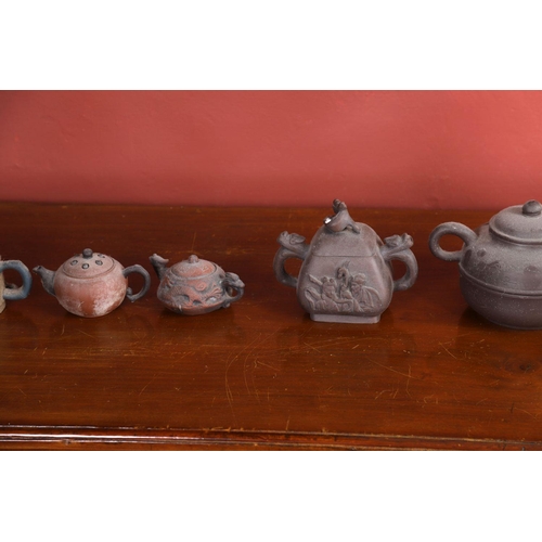 299 - GROUP OF 5 CHINESE YIXING TEAPOTS