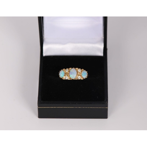 1154 - 18K YELLOW GOLD 3 STONE OPAL AND DIAMOND RING