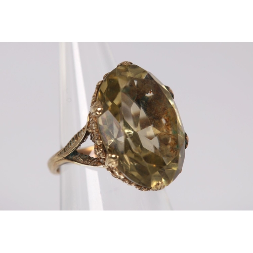 1193 - 9K YELLOW GOLD SMOKY TOPAZ RING