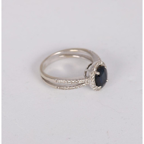 1239 - 14K WHITE GOLD SAPPHIRE AND DIAMOND RING