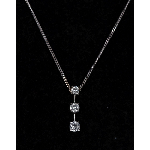 1245 - 18K WHITE GOLD AND 3 STONE DIAMOND PENDANT