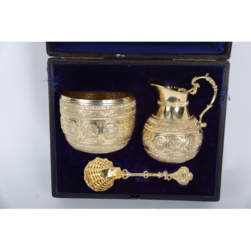 645 - CASED GILDED SILVER MILK JUG, SUGAR BOWL & SPOON