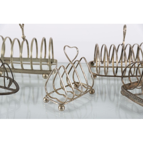 635 - GROUP OF SIX SILVER-PLATED TOAST RACKS