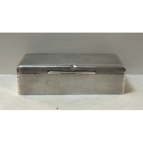 696 - SILVER CIGARETTE BOX of rectangular shape. London early 20th-century. 5 cm. high; 18 cm. wide; 9 cm.... 