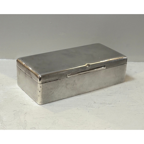 696 - SILVER CIGARETTE BOX of rectangular shape. London early 20th-century. 5 cm. high; 18 cm. wide; 9 cm.... 