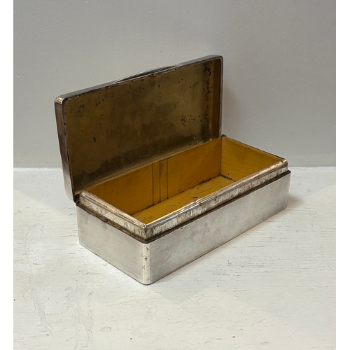 696 - SILVER CIGARETTE BOX of rectangular shape. London early 20th-century. 5 cm. high; 18 cm. wide; 9 cm.... 