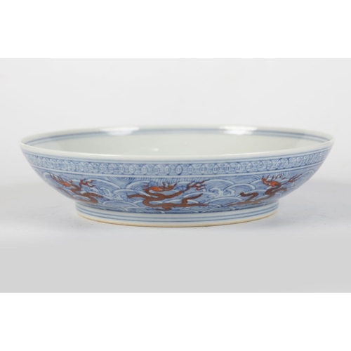 71 - CHINESE UNDERGLAZE BLUE & RED ENAMEL DRAGON DISH