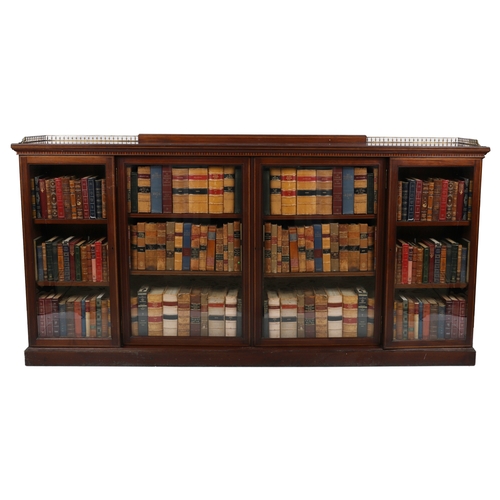 66 - EDWARDIAN MAHOGANY & INLAID LIBRARY BOOKCASE
the elongated satinwood crossbanded top below a 3/4 bra... 