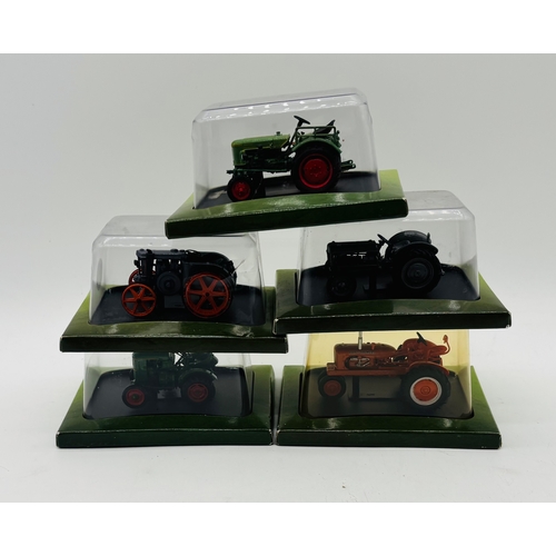 A collection of various sealed Hachette Partworks Ltd die-cast tractors ...