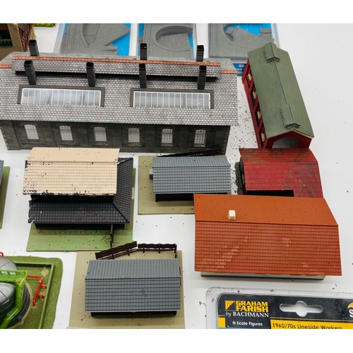 A collection of model railway N Gauge accessories including buildings ...
