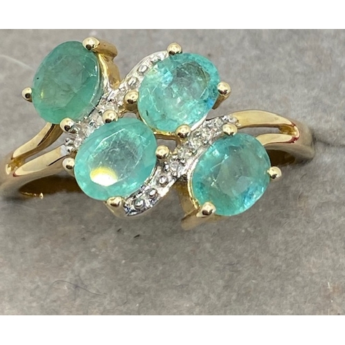 299 - 10k gold rings set with four emeralds, size N, hallmarked