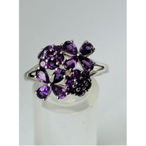 216 - 925 Silver Amethyst ring in pretty floral setting, size T