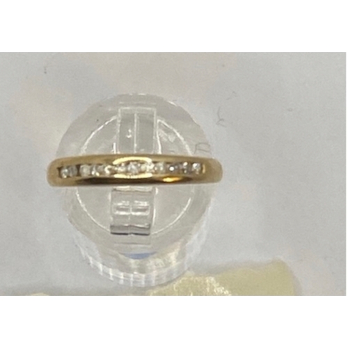 405 - 9ct gold and diamonds ( stamped 0.18 carats ) hallmarked channel set ring, M 1/2, 2g