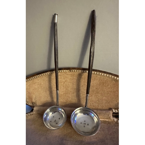 126 - Two silver toddy ladles with Birmingham and Chester hallmarks