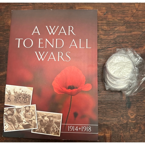 719 - 5 x Silver toned / silver coins (untested) together with A War to End All Wars commemorative pack