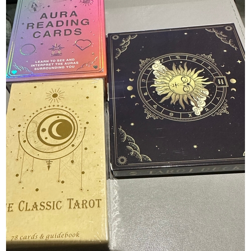 523 - small collection of unused Tarot and Aura reading cards, the two tarot card packs have guidebooks.