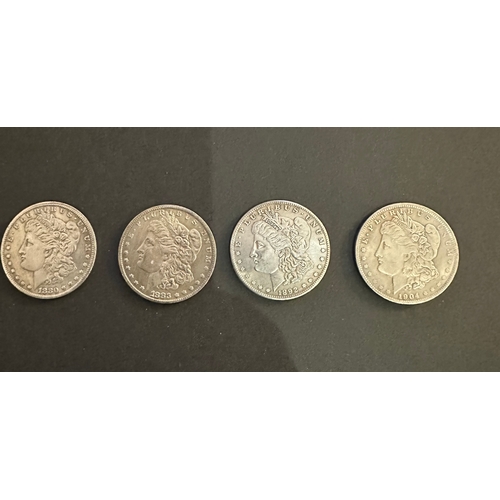 658 - four Morgan silver plated dollars 1880,1883, 1892 and 1904