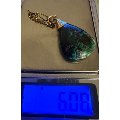 71 - gold pendant with semi-precious stone and safety chain