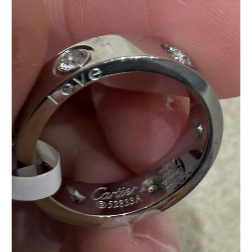 590 - silver coloured love ring, replica, no guarantees given or implied that this is made from precious m... 